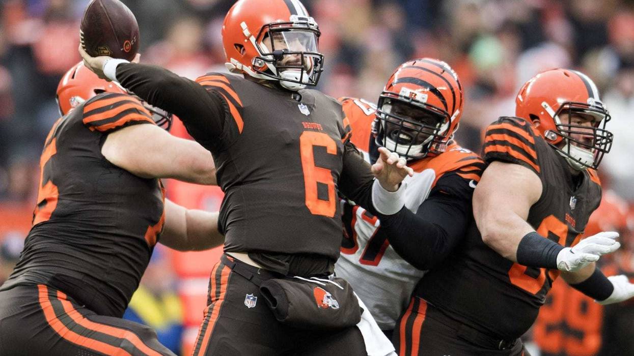 Dec 23, 2018; Cleveland, OH, USA; Cleveland Browns quarterback Baker Mayfield (6) throws a pass as Cincinnati Bengals defensive tackle Geno Atkins (97) rushes during the second half at FirstEnergy Stadium. Mandatory Credit: Ken Blaze-USA TODAY Sports
