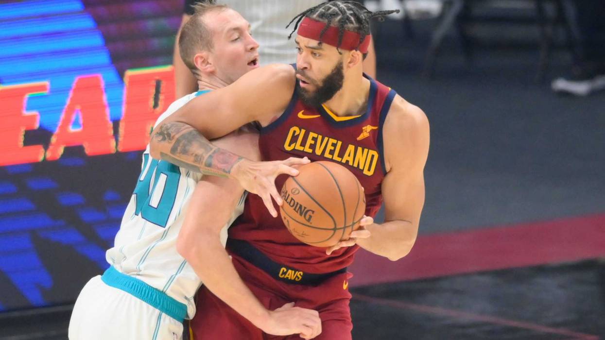 Dec 23, 2020; Cleveland, Ohio, USA; Charlotte Hornets forward Cody Zeller (40) defends Cleveland Cavaliers center JaVale McGee (6) in the second quarter at Rocket Mortgage FieldHouse.