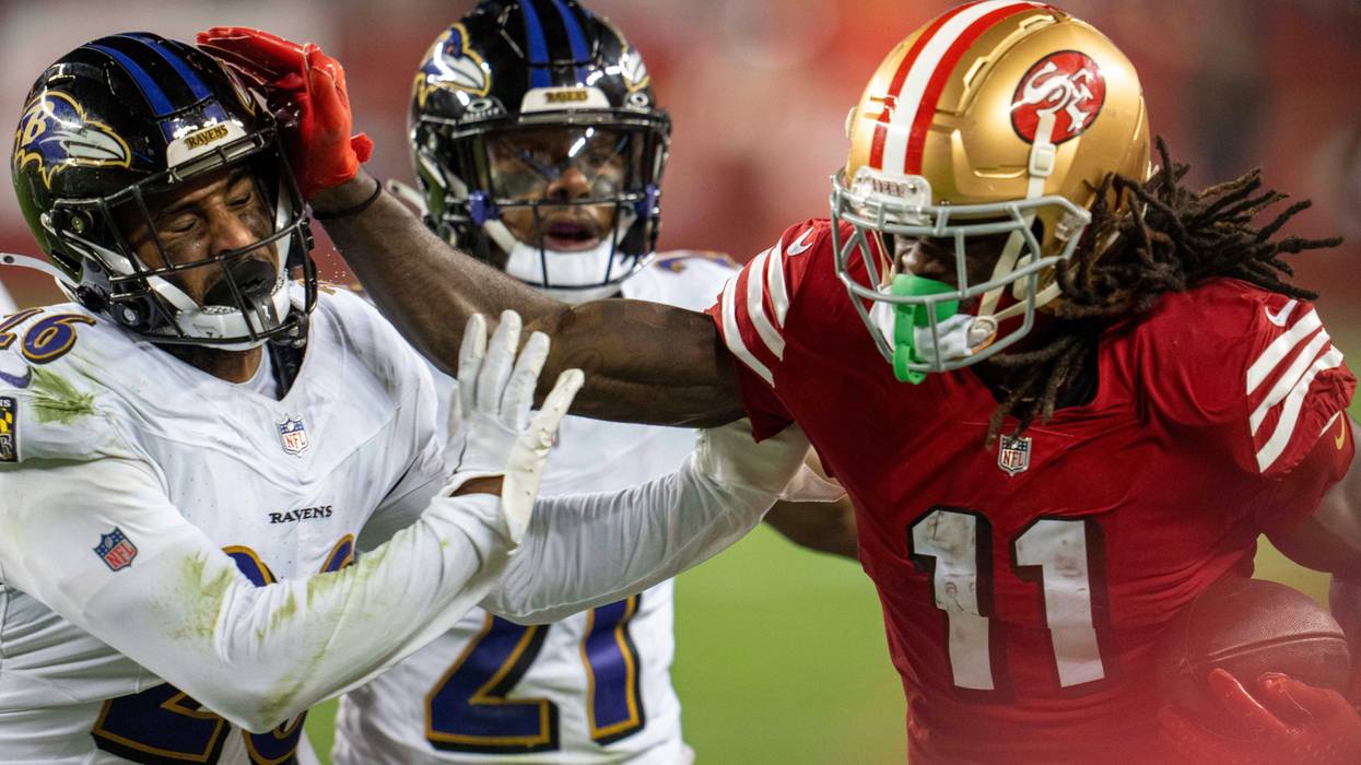 Dec 25, 2023; Santa Clara, California, USA; San Francisco 49ers wide receiver Brandon Aiyuk (11) rushes for the first down against Baltimore Ravens safety Geno Stone (26) during the fourth quarter at Levi's Stadium.