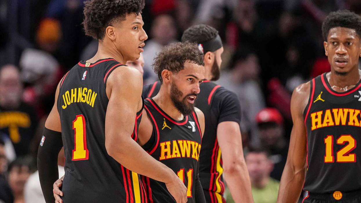 Dec 28, 2024; Atlanta, Georgia, USA; Atlanta Hawks guard Trae Young (11) reacts with forward Jalen Johnson (1) after the Hawks defeated the Miami Heat at State Farm Arena. Mandatory Credit: Dale Zanine-Imagn Images