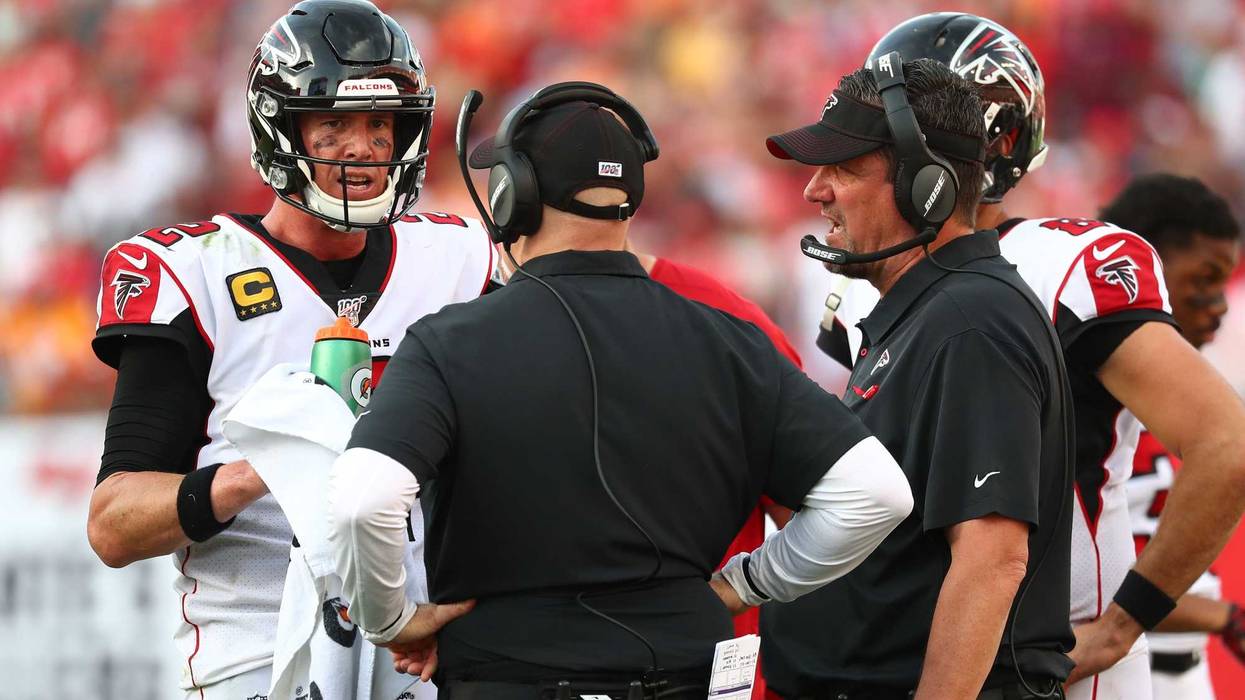 Dec 29, 2019; Tampa, Florida, USA;Atlanta Falcons quarterback Matt Ryan (2) talks with head coach Dan Quinn and quarterback coach Greg Knapp during the second half against the Tampa Bay Buccaneers at Raymond James Stadium. Mandatory Credit: Kim Klement-US