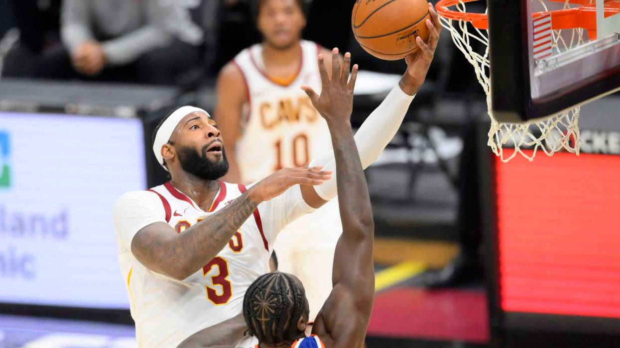 Dec 29, 2020; Cleveland, Ohio, USA; Cleveland Cavaliers center Andre Drummond (3) drives against New York Knicks forward Julius Randle (30) in the third quarter at Rocket Mortgage FieldHouse.