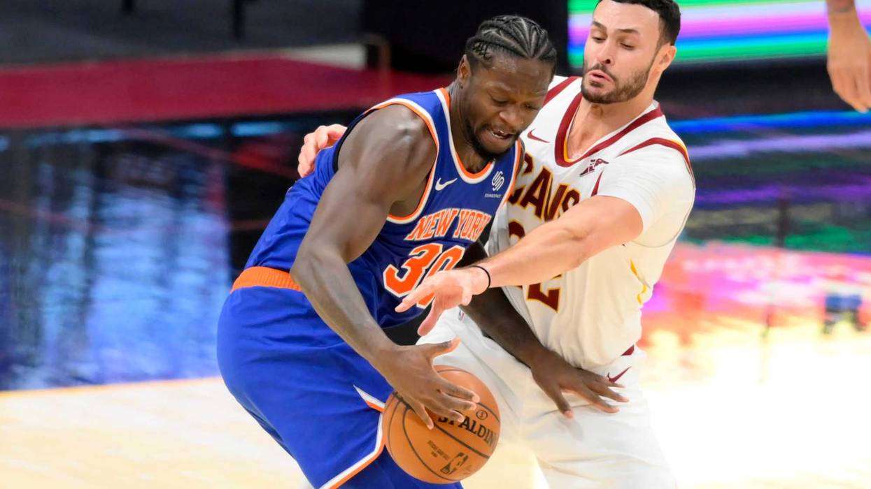 Dec 29, 2020; Cleveland, Ohio, USA; Cleveland Cavaliers forward Larry Nance Jr. (22) defends New York Knicks forward Julius Randle (30) in the third quarter at Rocket Mortgage FieldHouse.