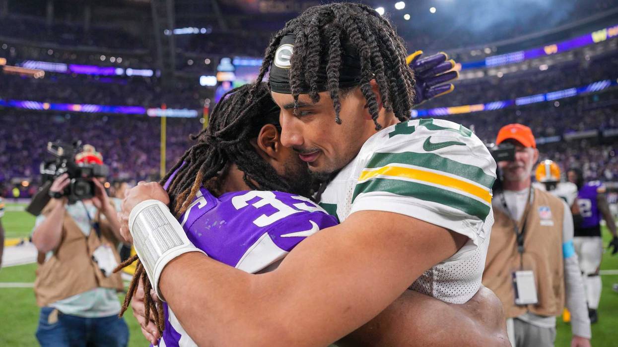Dec 29, 2024; Minneapolis, Minnesota, USA; Green Bay Packers quarterback Jordan Love (10) and Minnesota Vikings running back Aaron Jones (33) hug after the game at U.S. Bank Stadium. Mandatory Credit: Brad Rempel-Imagn Images