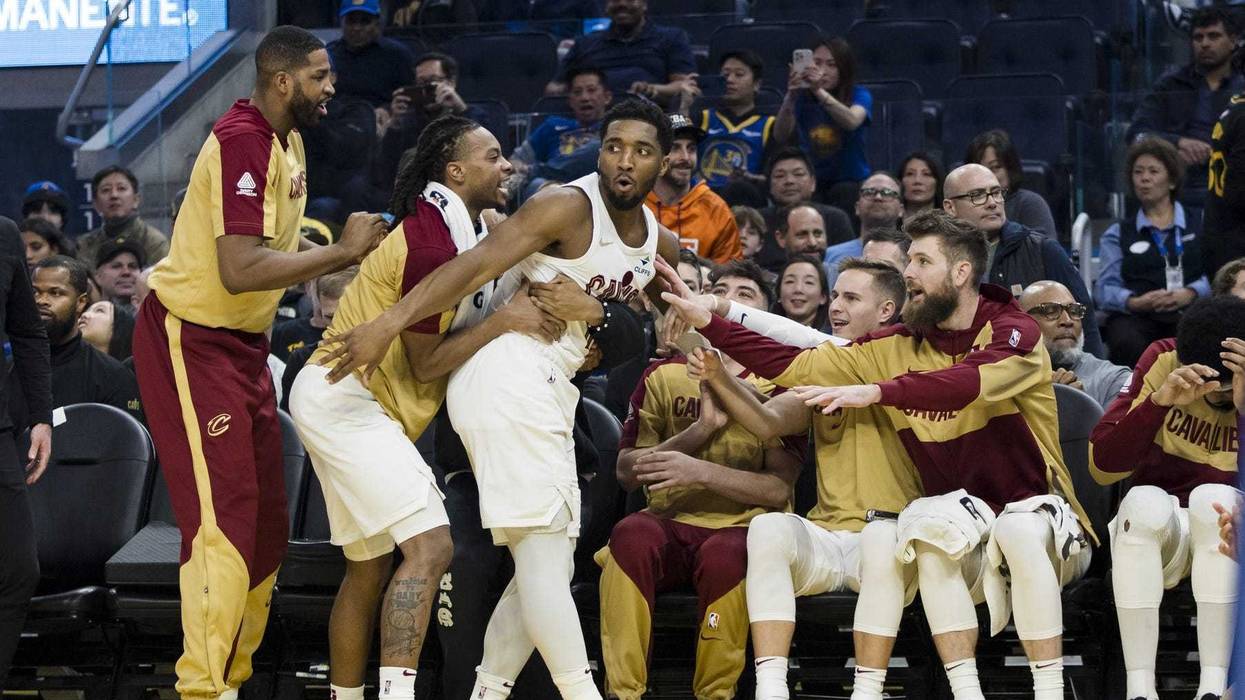 Dec 30, 2024; San Francisco, California, USA; Cleveland Cavaliers guard Donovan Mitchell (45) falls into the bench after colliding with a Golden State Warriors player during the second quarter at Chase Center.