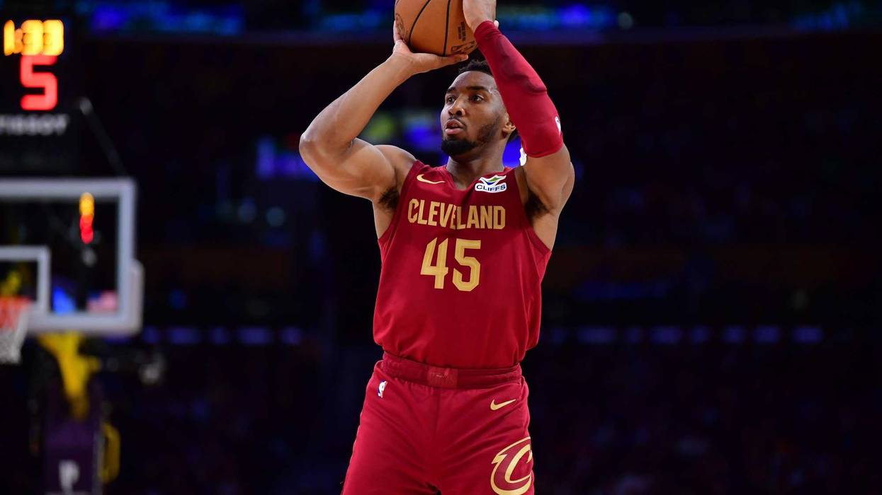 Dec 31, 2024; Los Angeles, California, USA; Cleveland Cavaliers guard Donovan Mitchell (45) shoots against the Los Angeles Lakers during the second half at Crypto.com Arena.