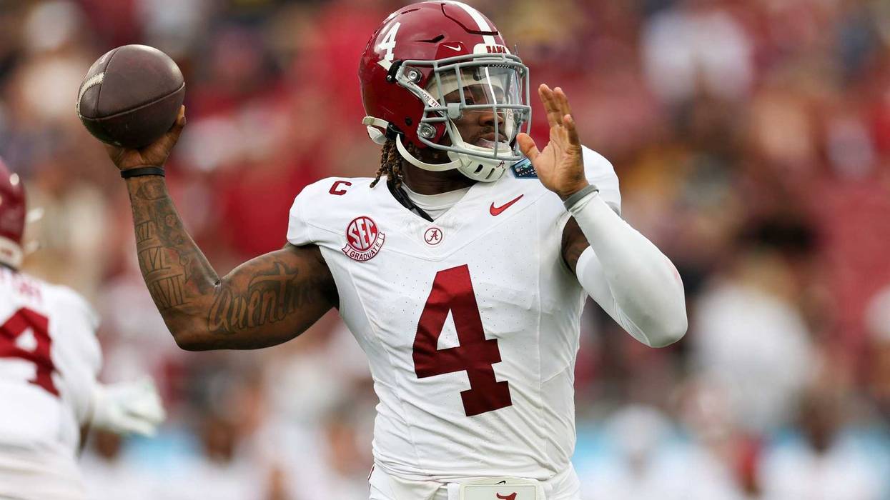 Dec 31, 2024; Tampa, FL, USA; Alabama Crimson Tide quarterback Jalen Milroe (4) drops back to pass against the Michigan Wolverines in the first quarter during the ReliaQuest Bowl at Raymond James Stadium.