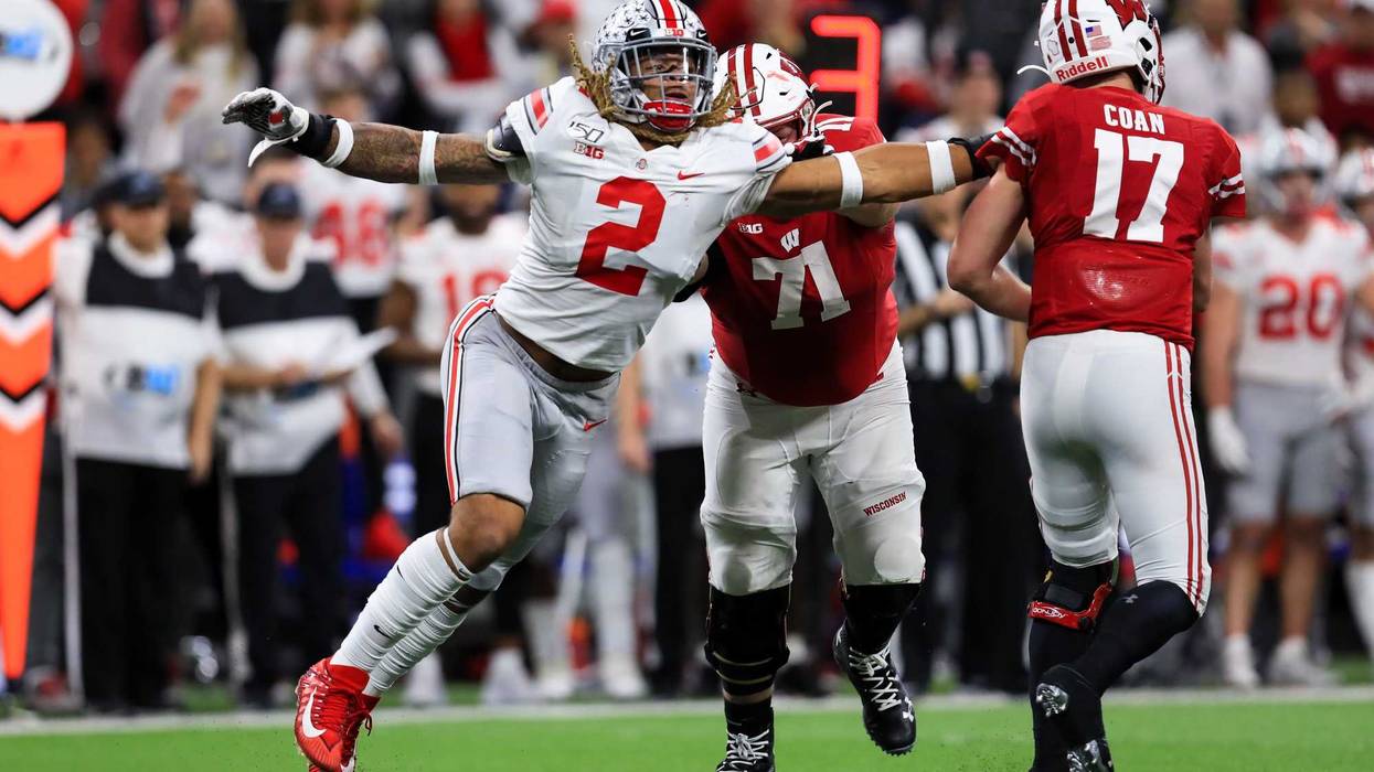 Dec 7, 2019; Indianapolis, IN, USA; Ohio State Buckeyes defensive end Chase Young (2) grabs onto the jersey of Wisconsin Badgers quarterback Jack Coan (17) as he throws during the first half in the 2019 Big Ten Championship Game at Lucas Oil Stadium.