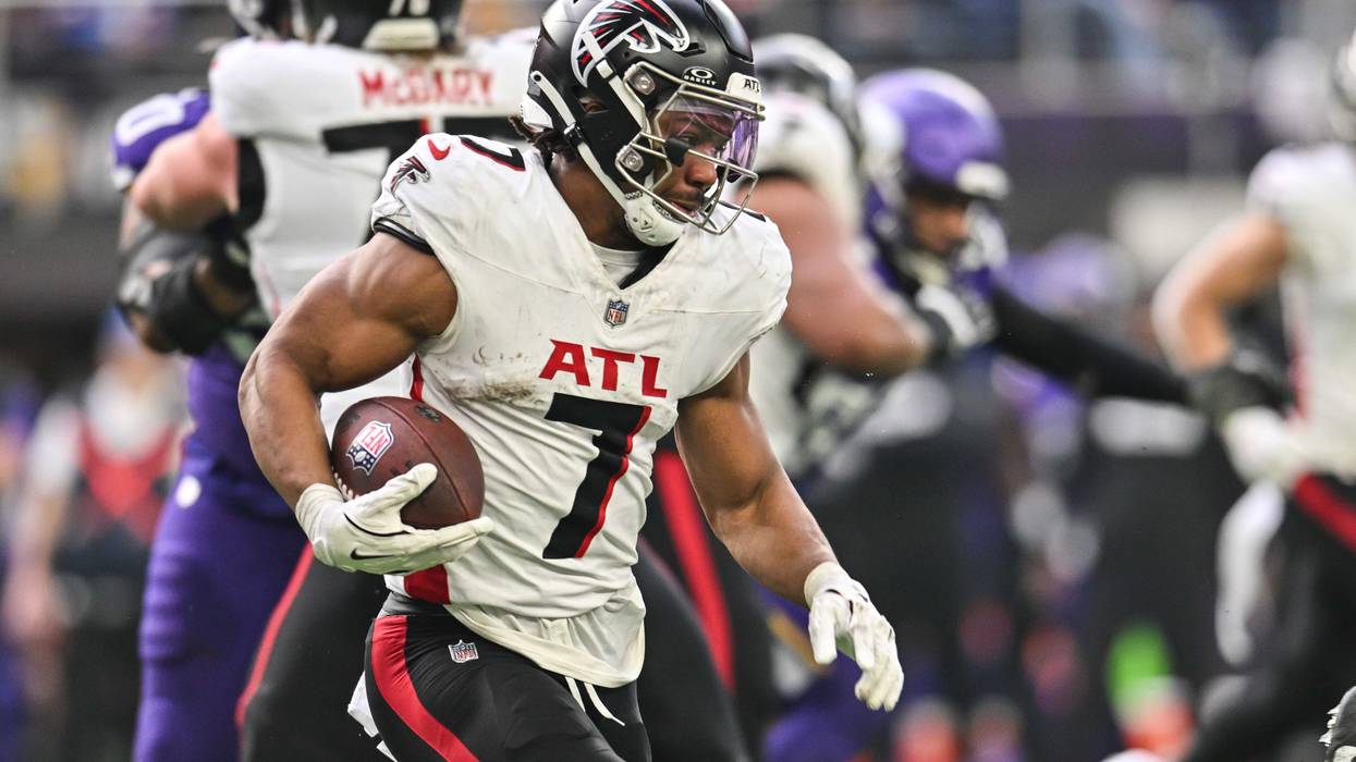 Dec 8, 2024; Minneapolis, Minnesota, USA; Atlanta Falcons running back Bijan Robinson (7) runs the ball against the Minnesota Vikings during the second quarter at U.S. Bank Stadium. Mandatory Credit: Jeffrey Becker-Imagn Images