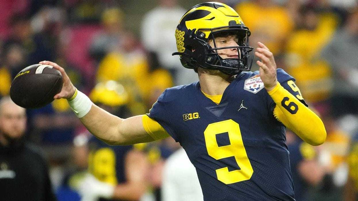 December 31, 2022; Glendale, Ariz; USA; Michigan quarterback JJ McCarthy (9) throws a pass during the pregame before the Fiesta Bowl at State Farm Stadium. Ncaa Fiesta Bowl Game