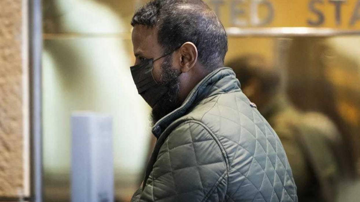 Defendant Abdiaziz Shafii Farah walks into United States District Court during the third day of jury selection in the first Feeding Our Future case to go to trial in Minneapolis, April 24, 2024.