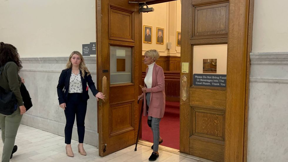 Defendant Renee DiPietro leaves the Montgomery County courtroom.