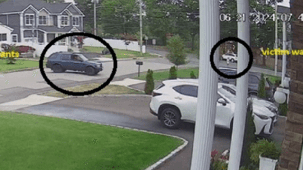 Defendants allegedly in blue Isuzu near the victim walking.