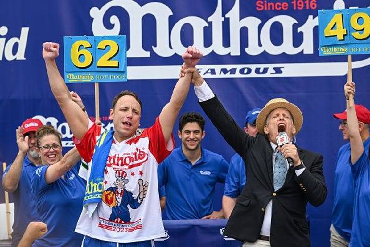 Defending champion Joey Chestnut cheers after finishing in first place in the 2023 Nathan's Famous Fourth of July International Hot Dog Eating Contest on July 4, 2023 at Coney Island in the Brooklyn borough of New York City