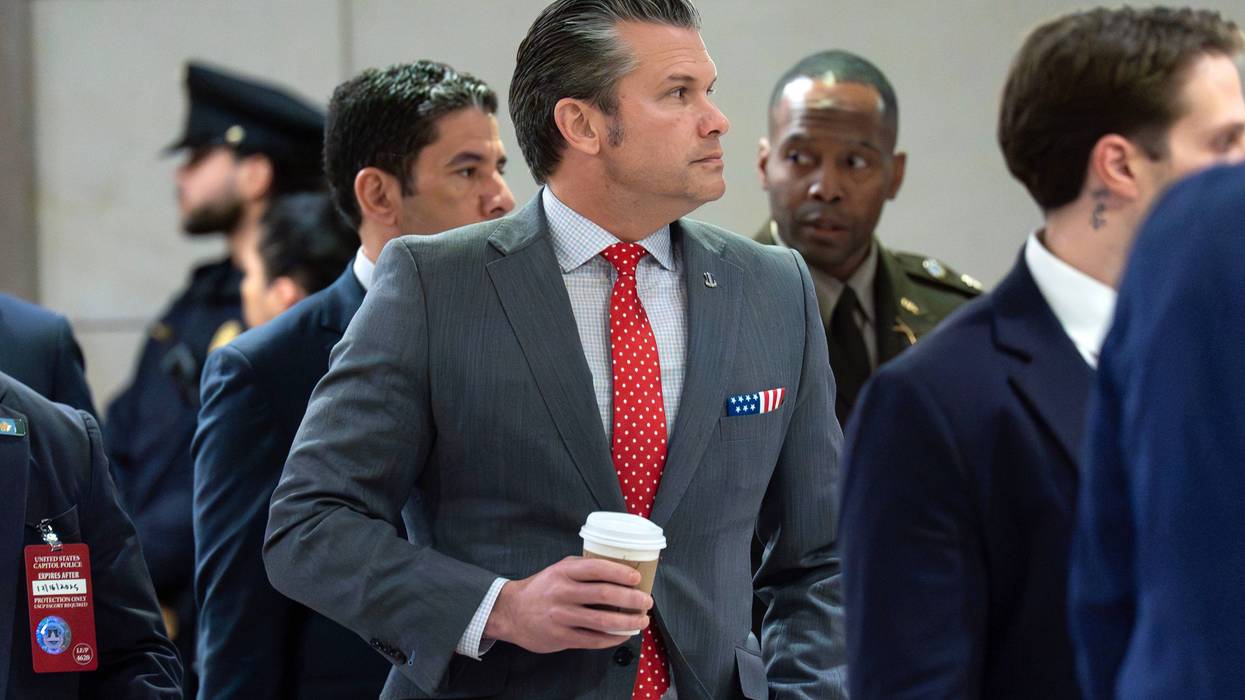Defense Secretary Pete Hegseth walks to the auditorium to brief members of Congress on military strikes near Venezuela at the Capitol, Tuesday, Dec. 16, 2025, in Washington.