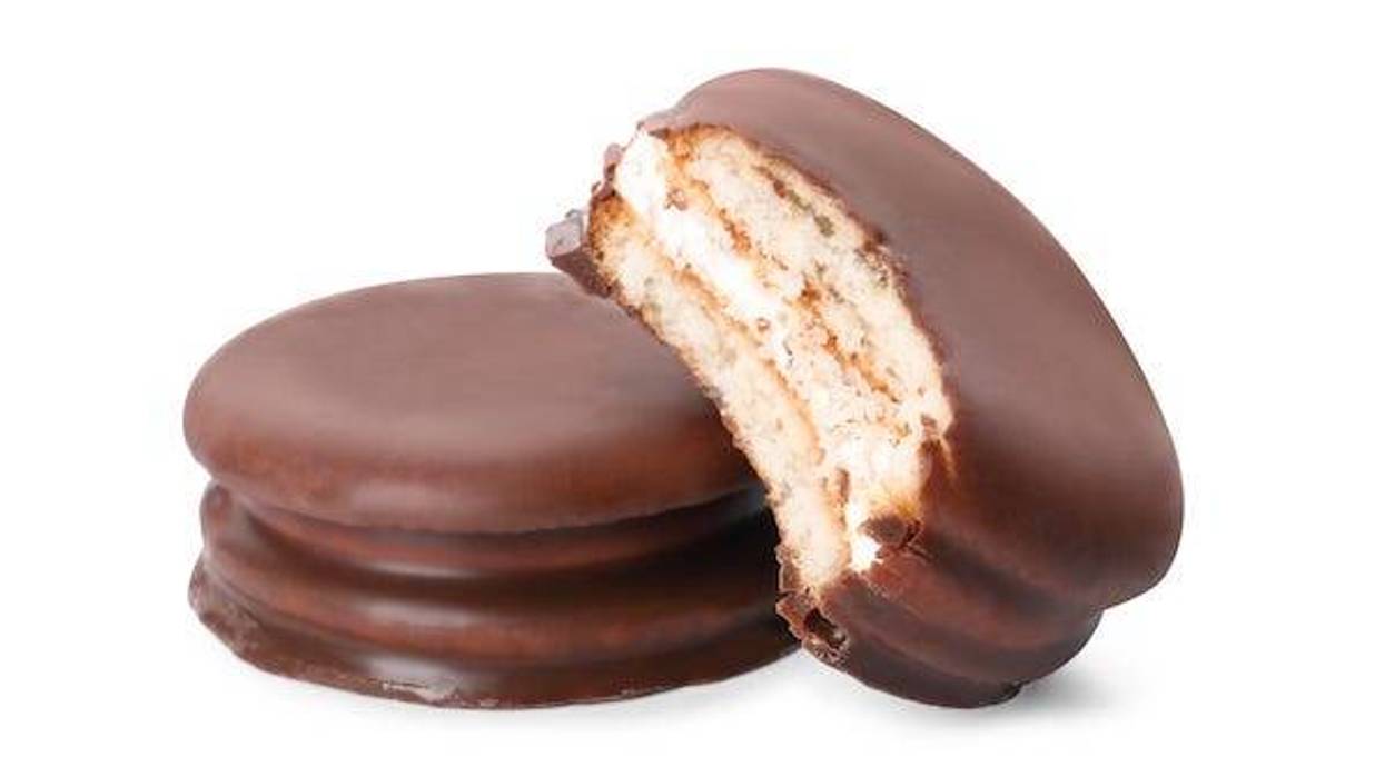 Delicious choco pies on white background. Classic snack cakes