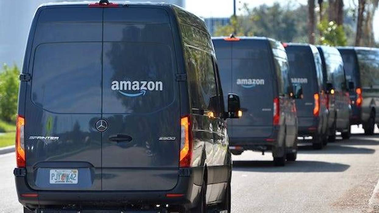 Delivery trucks line up outside the Amazon distribution center