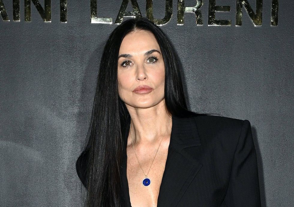 Demi Moore, 59, takes the plunge in revealing black outfit at Paris fashion show