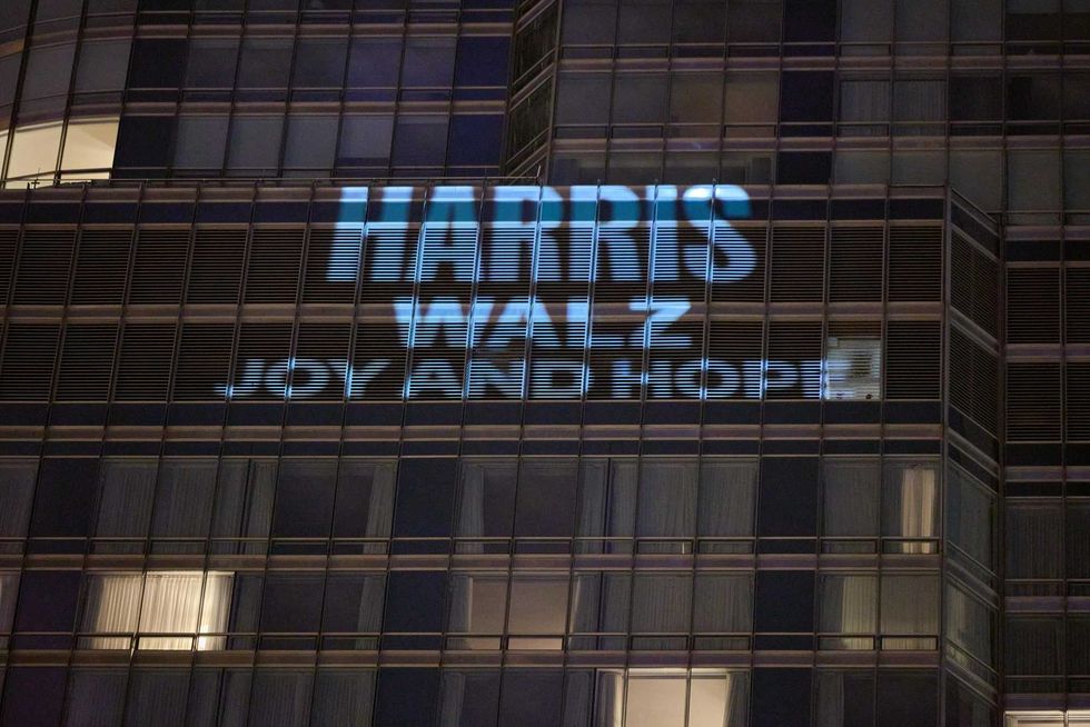 Democratic National Committee projects images on Trump Tower
