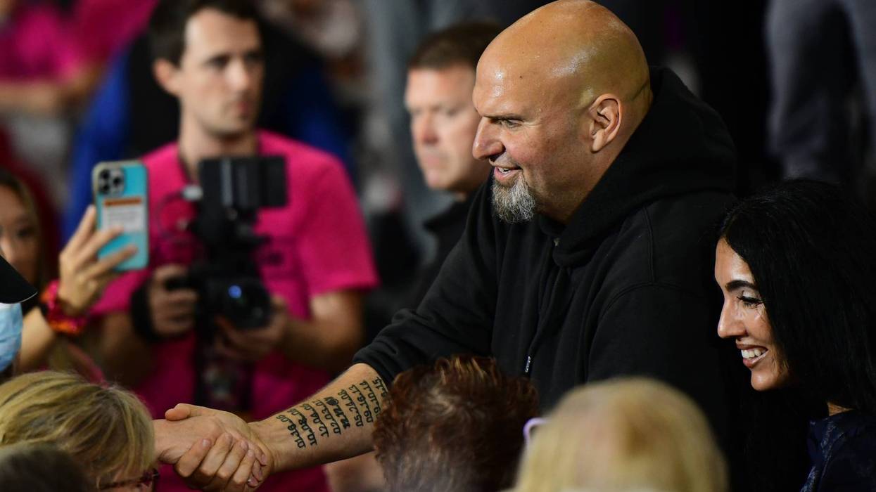 Democratic Pennsylvania Senate nominee John Fetterman greets supporters during a rally with U.S. Congresswomen Madeleine Dean and Mary Gay Scanlon on September 11, 2022 at Montgomery County Community College in Blue Bell, Pennsylvania.