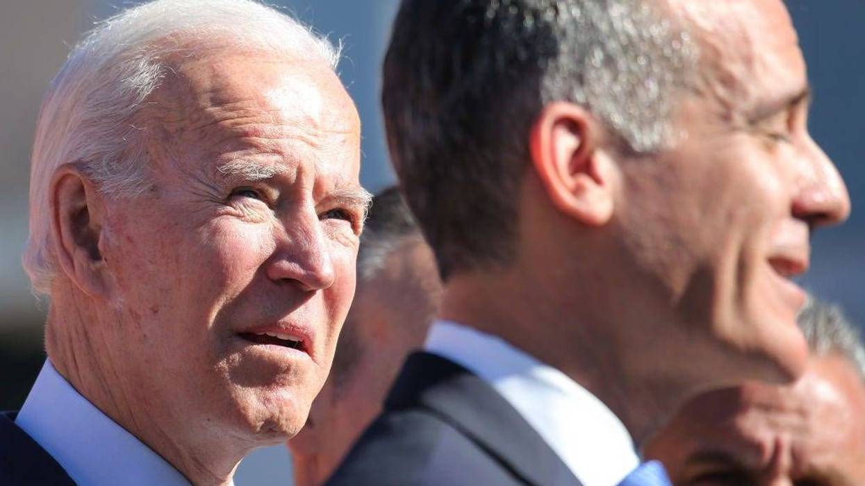 Democratic presidential candidate former U.S. Vice President Joe Biden (L) looks on as Los Angeles Mayor Eric Garcetti speaks at a campaign event at United Firefighters of Los Angeles City on January 10, 2020 in Los Angeles, California. Garcetti endorsed Biden yesterday.
