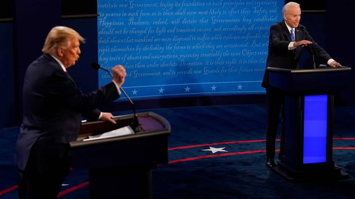 Democratic presidential candidate former Vice President Joe Biden answers a question as President Donald Trump listens during the second and final presidential debate at Belmont University on October 22, 2020 in Nashville, Tennessee.