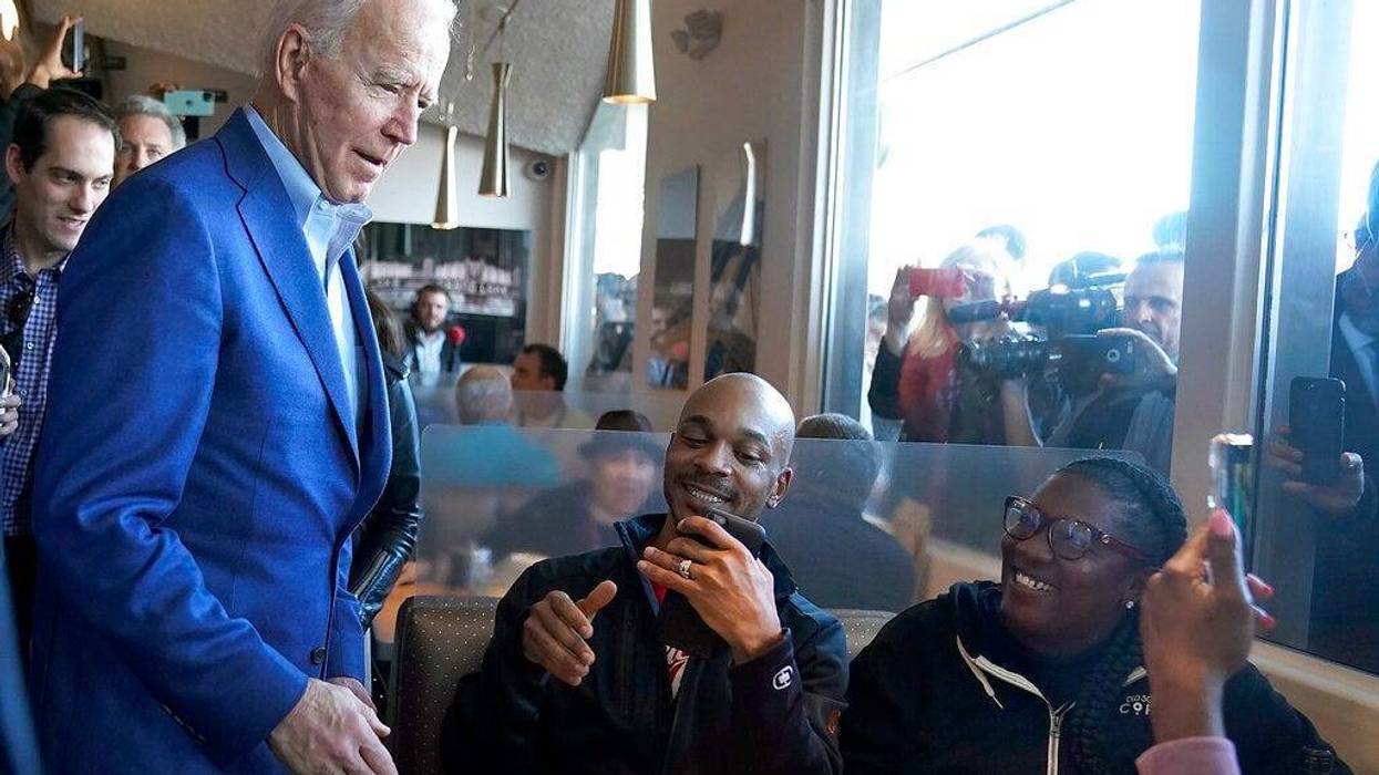 Democratic presidential candidate former Vice President Joe Biden talks with customers at the Buttercup Diner during a campaign stop in Oakland, Calif., Tuesday, March 3, 2020.