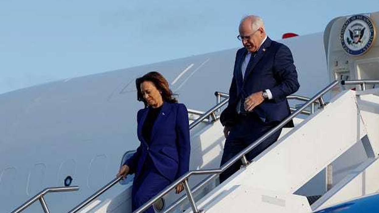 Democratic presidential candidate, U.S. Vice President Kamala Harris and vice presidential candidate Minnesota Gov. Tim Walz walk off Air Force 2 at the Milwaukee Mitchell International Airport on August 20, 2024 in Milwaukee, Wisconsin.