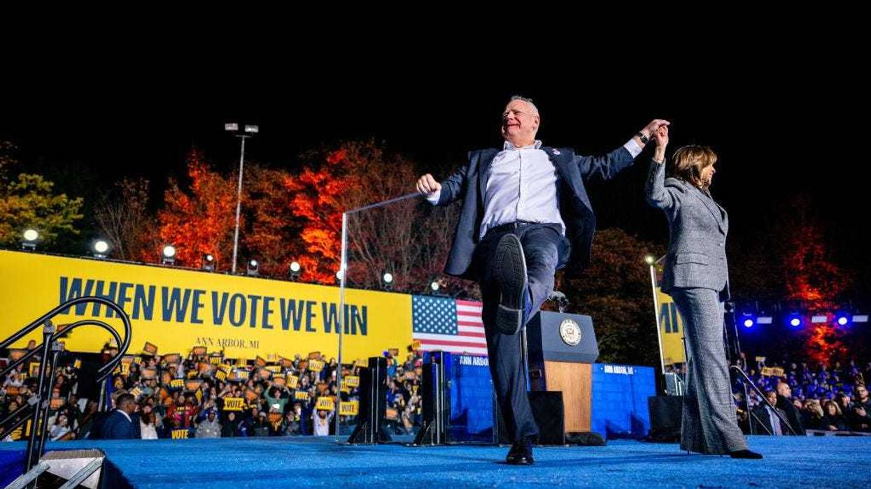 Democratic presidential nominee, U.S. Vice President Kamala Harris and running mate Democratic vice presidential nominee, Minnesota Gov. Tim Walz greet supporters at the conclusion of a campaign rally on October 28, 2024 in Ann Arbor, Michigan.