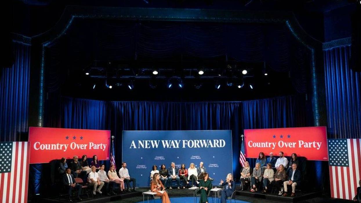 Democratic presidential nominee, Vice President Kamala Harris sits with former U.S. Rep. Liz Cheney (R-WY) for a town hall with Maria Shriver at the Royal Oak Music Theatre on October 21