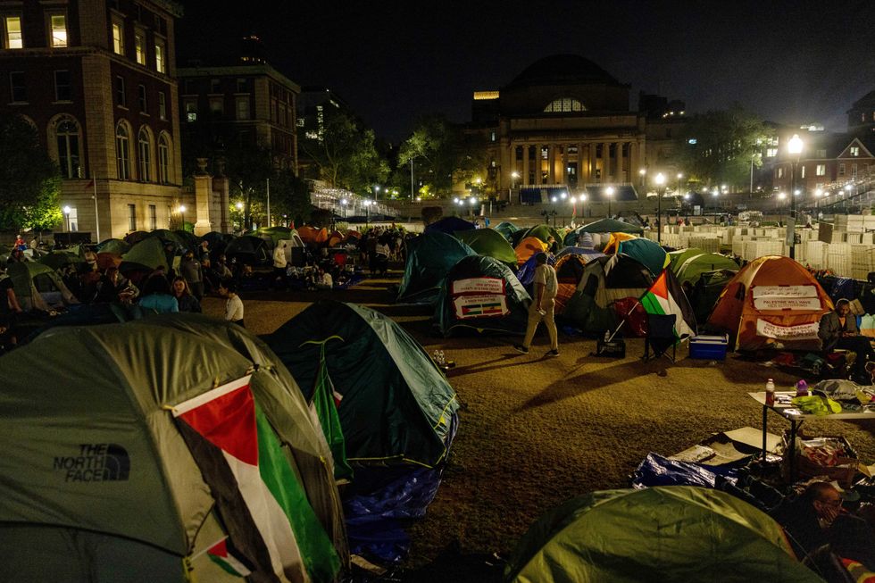 Demonstrators at Columbia University remain on the lawn in support of Palestinians in Gaza on April 29, 2024 in New York City. Pro-Palestinian demonstrators marched as a 2 p.m. deadline to clear the encampment given to students by the university came and went. The students were given a suspension warning if they did not meet the deadline. Students at Columbia were the first from an elite college to erect an encampment, demanding that the school divest from Israel amid the Israel-Hamas war, in which more than 34,000 Palestinians have been killed in the Gaza Strip. (Photo by Alex Kent/Getty Images)