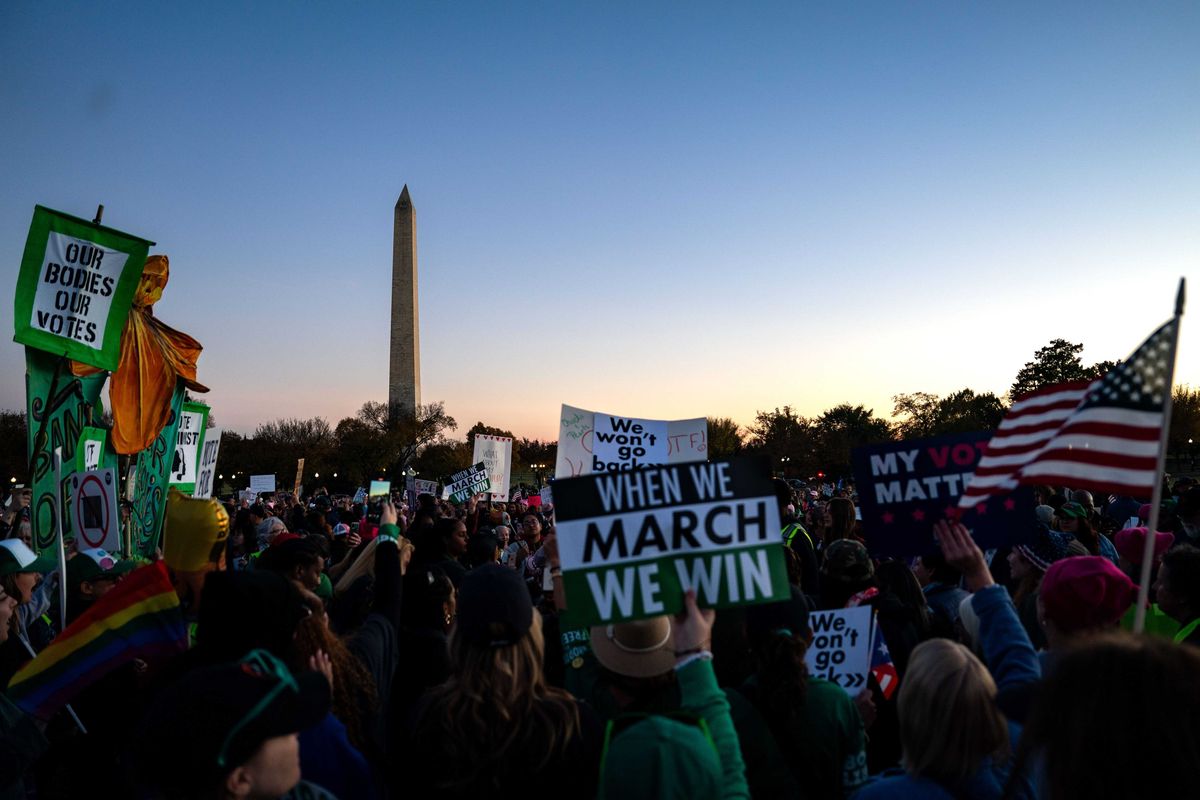 Demonstrators gather at the Ellipse, after marching from Freedom Plaza for the Women's March on November 02, 2024 in Washington, DC. Demonstrators are marching on the weekend before Election Day to show support for reproductive rights.