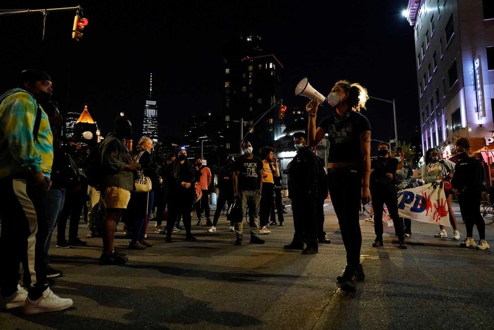 Demonstrators gather in Manhattan at the entrance of the Manhattan Bridge after marching through downtown Brooklyn as former police officer Derek Chauvin is convicted on all three counts for the murder of George Floyd on Tuesday, April 20, 2021