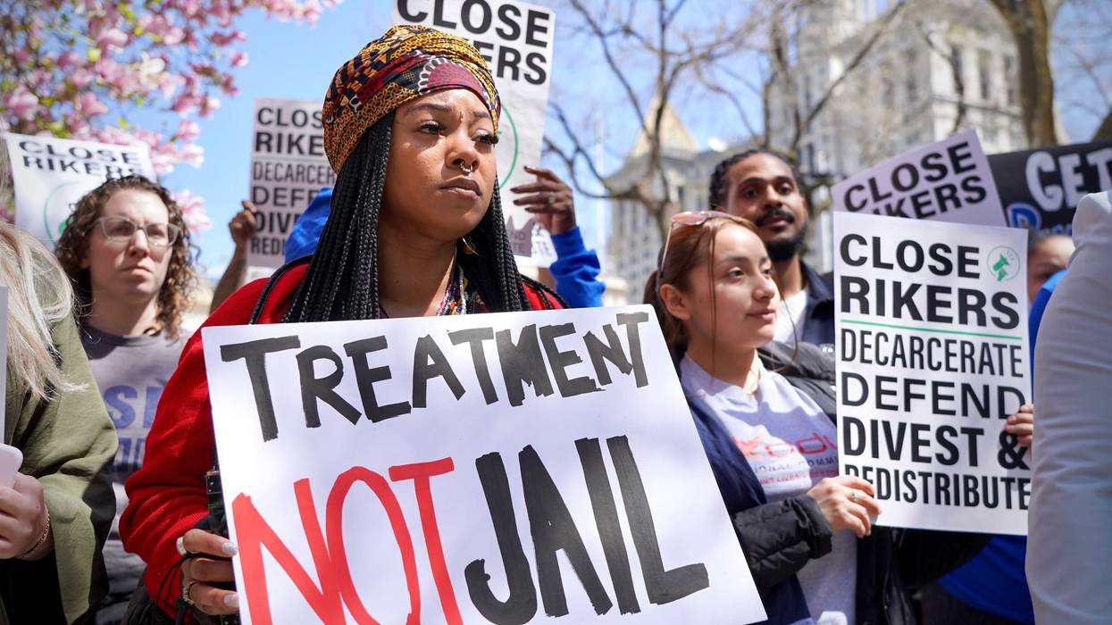 Demonstrators gathered outside City Hall on Tuesday to show support for a plan to close reduce the number of people detained at Rikers and close the prison by the summer of 2027.
