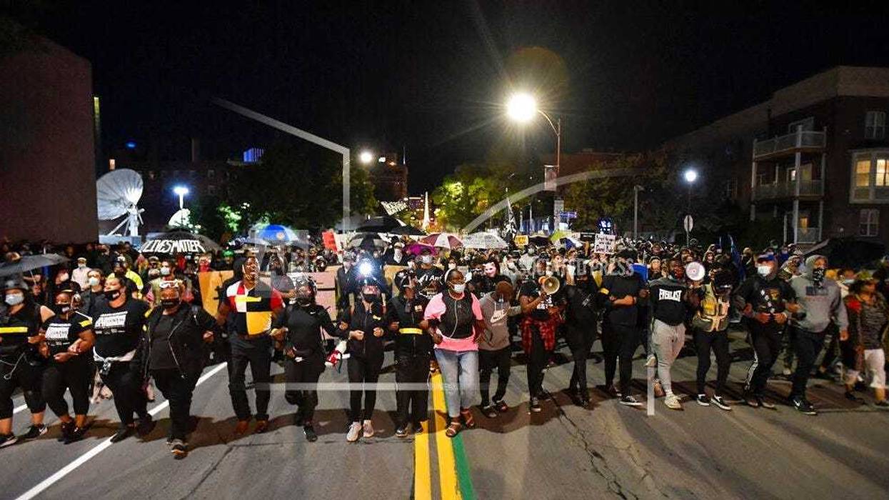 Demonstrators march through the streets in Rochester, N.Y., Friday, Sept. 4, 2020, protesting the death of Daniel Prude.