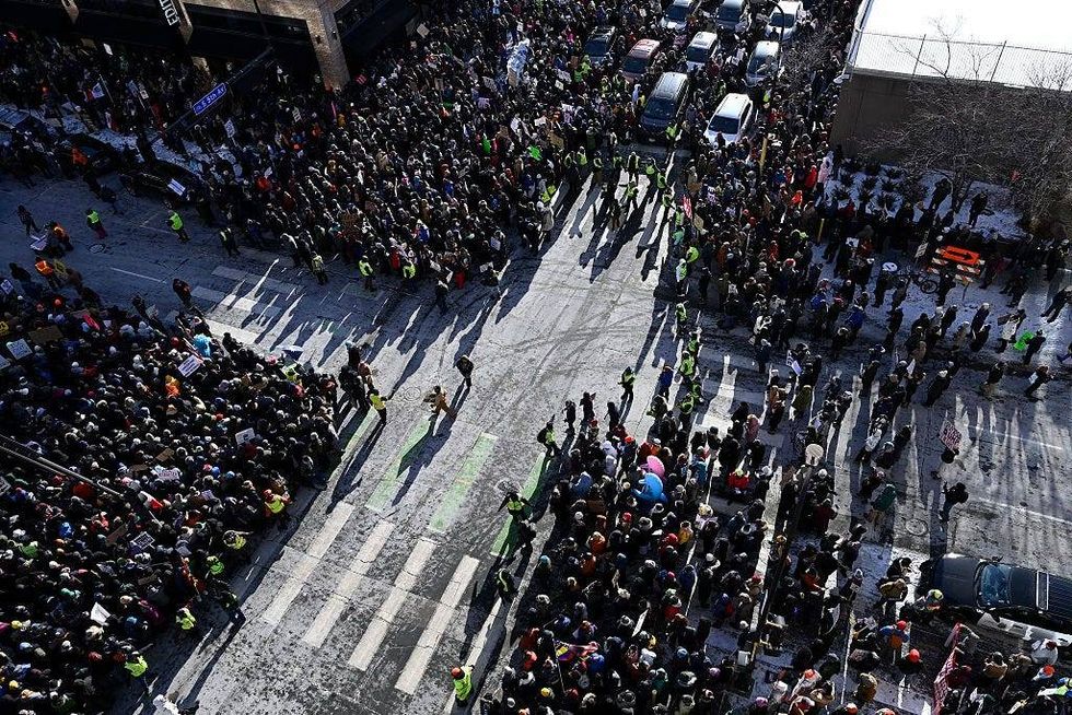 Demonstrators participate in a rally and march during an "ICE Out” day of protest on January 23, 2026 in Minneapolis, Minnesota.