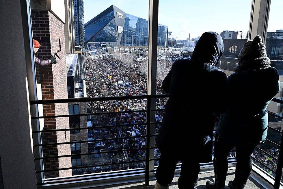 Demonstrators participate in a rally and march during an "ICE Out” day of protest on January 23, 2026 in Minneapolis, Minnesota.