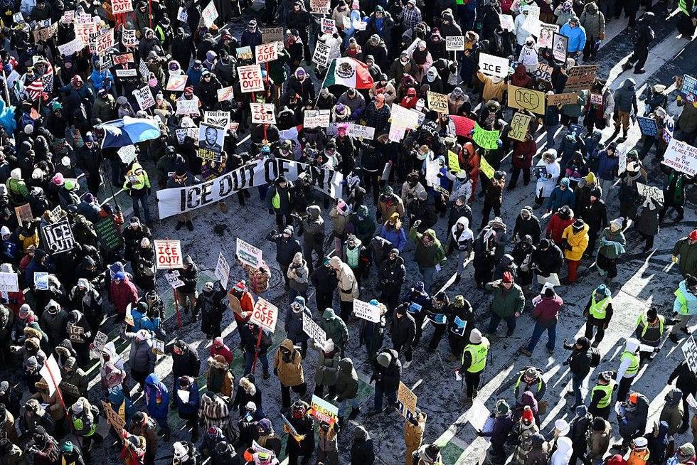 Demonstrators participate in a rally and march during an "ICE Out” day of protest on January 23, 2026 in Minneapolis, Minnesota.