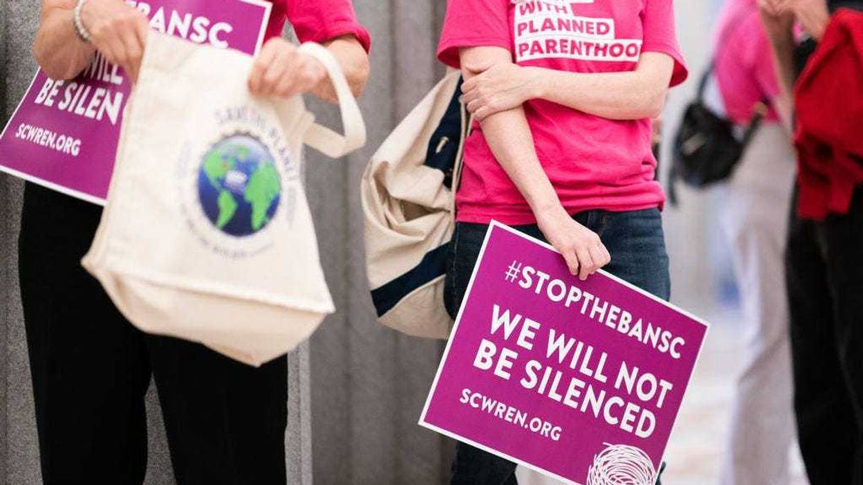 Demonstrators wait for lawmakers to arrive before the South Carolina Senate passed a ban on abortion after six weeks of pregnancy at the South Carolina Statehouse on May 23, 2023 in Columbia, South Carolina. A bi-partisan group of five women led a filibuster that failed to block the legislation. (Photo by Sean Rayford/Getty Images)