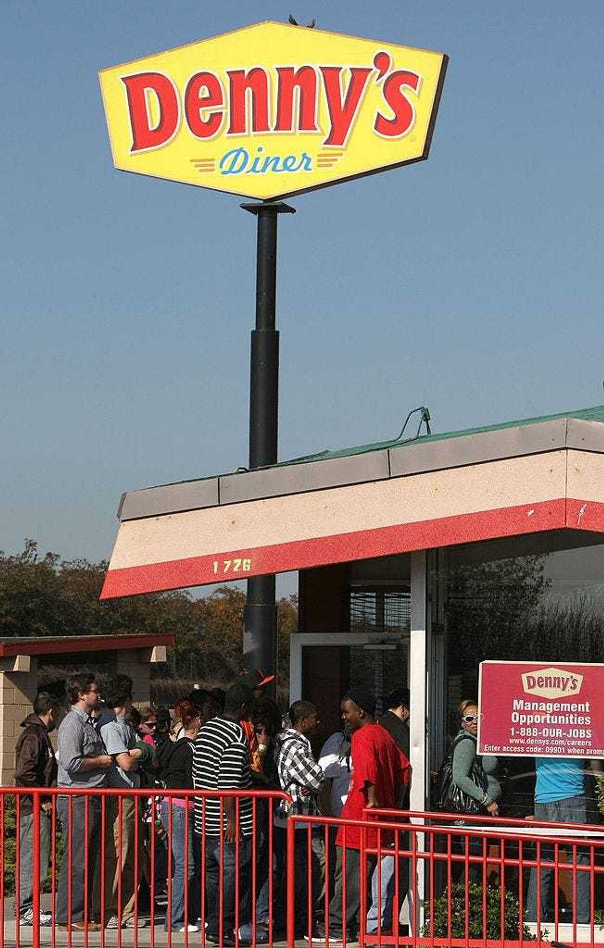 Denny's customers wait in line to get a free breakfast February 3, 2009 in Emeryville, California.