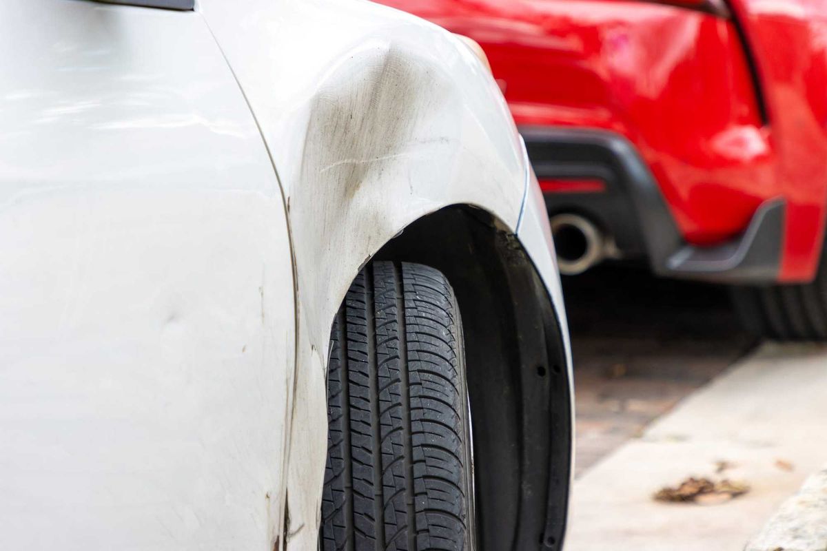 Dented vehicle after a minor car crash.
