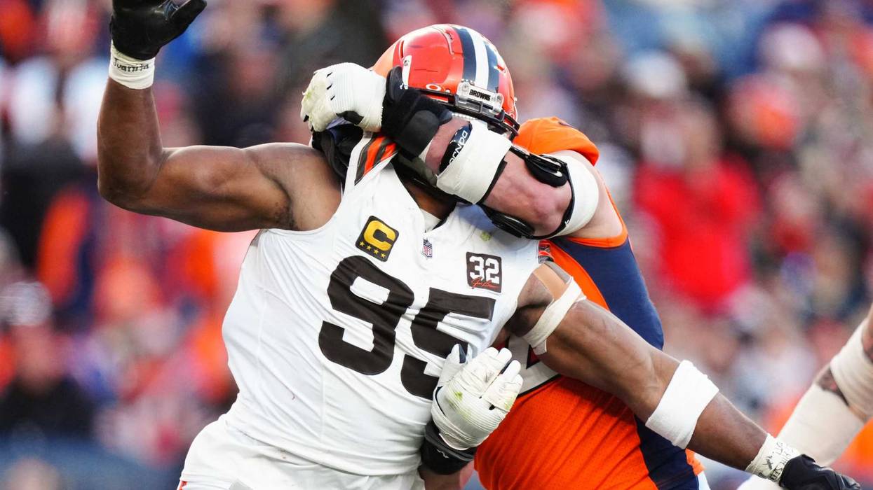 Denver Broncos offensive tackle Garett Bolles (72) holds Cleveland Browns defensive end Myles Garrett (95) in the second quarter at Empower Field at Mile High.