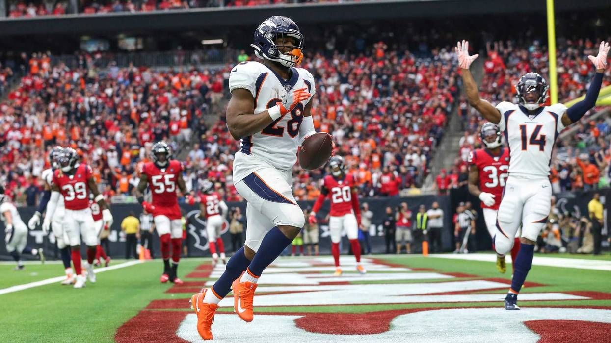 Denver Broncos running back Royce Freeman (28) scores a touchdown during the second quarter against the Houston Texans at NRG Stadium.