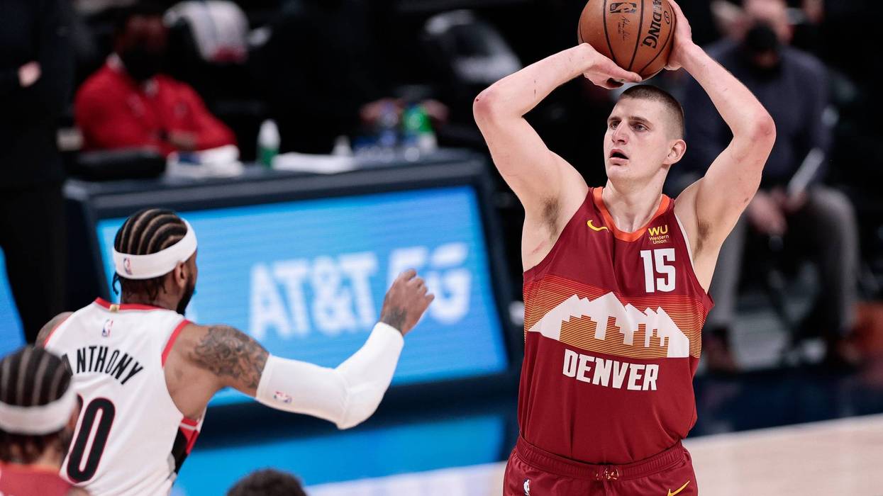 Denver Nuggets star Nikola Jokic attempts a jump shot.