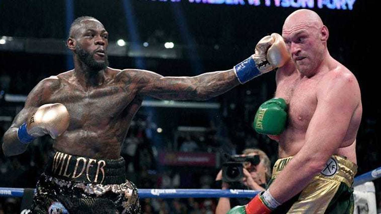 Deontay Wilder punches Tyson Fury in the ninth round fighting to a draw during the WBC heavyweight championship at Staples Center on Dec. 1, 2018 in Los Angeles, California.