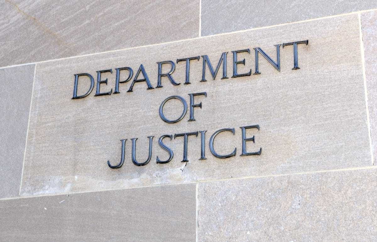 Department of Justice sign, Washington DC, USA.