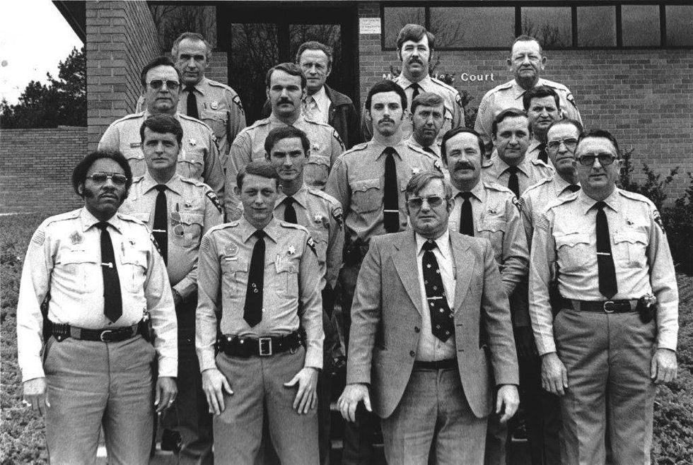 Deputy Charles Reid, first from left