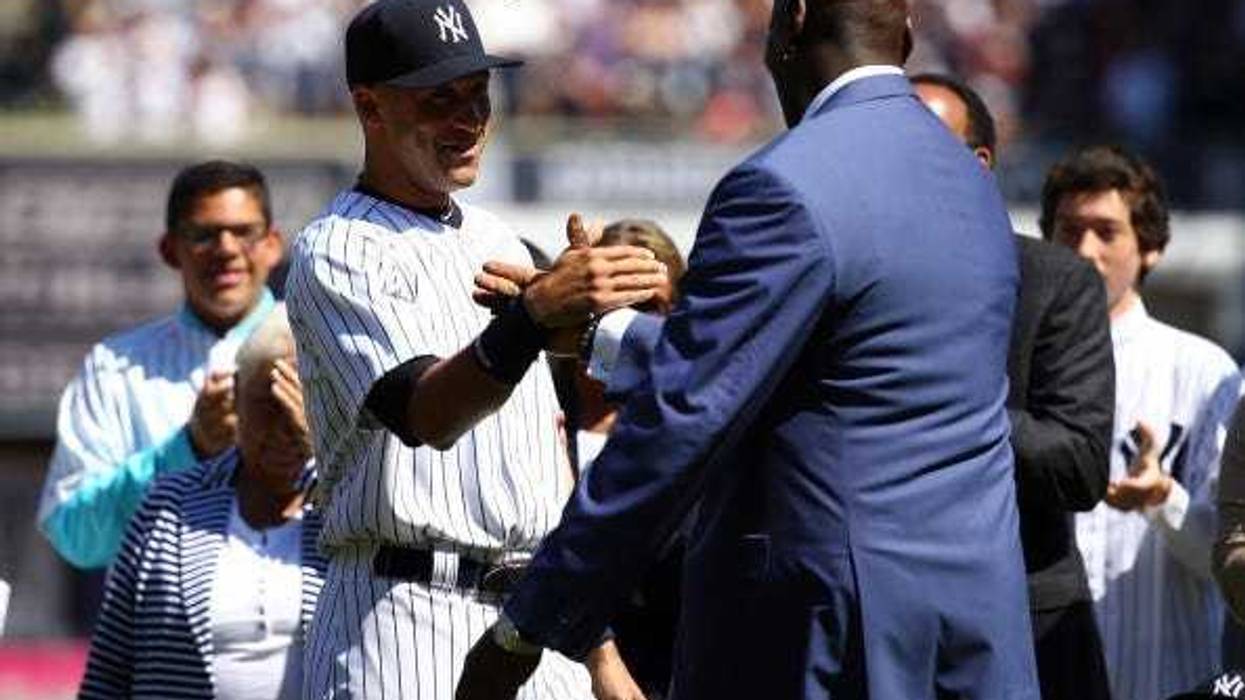 Derek Jeter and Michael Jordan embrace