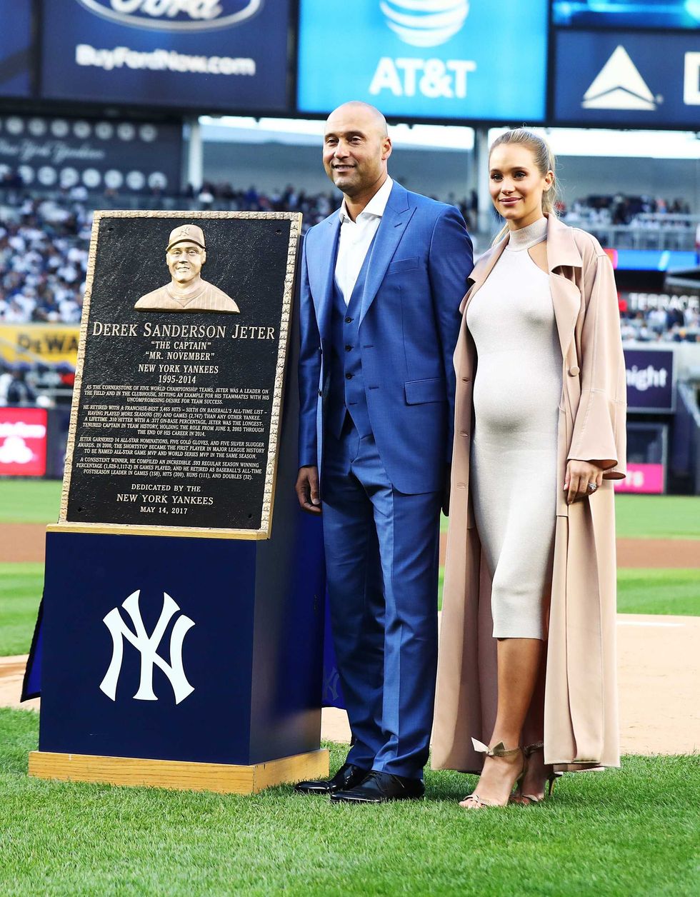 Derek Jeter poses with his Wife Hannah Davis during the retirement ceremony of his number 2 jersey at Yankee Stadium on May 14, 2017 in New York City.