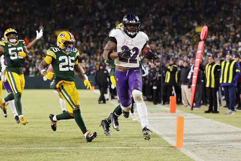 Derrick Henry #22 of the Baltimore Ravens scores a touchdown in the fourth quarter against the Green Bay Packers at Lambeau Field on December 27, 2025 in Green Bay, Wisconsin.